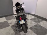 a motorcycle that is sitting on a checkered floor