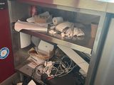 a picture of a kitchen with a bunch of clutter on the floor