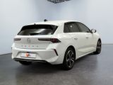 the rear end of a white car in a white room