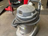 a machine that is sitting on the floor in a garage