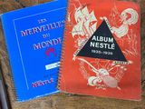 two books that are sitting on a wooden table