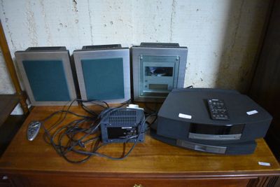 three televisions sitting on top of a wooden dresser