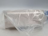 a bag of toilet paper and a bottle of water on a table