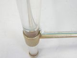 a close up of a glass vase with a metal handle