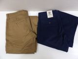 two pairs of men ' s khaki pants on a white surface