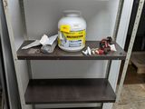 a shelf that has a bucket of paint on it