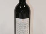 a bottle of wine that is sitting on a table