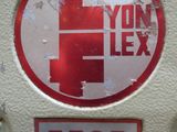 a red and white sign on the side of a white pole