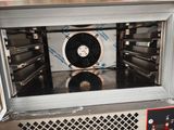 une image représentant un four avec un ventilateur à l'intérieur