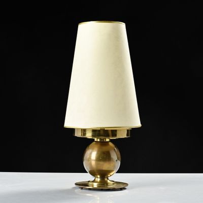 a close up of a lamp on a table with a black background