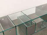 a glass table with drawers and drawers on it