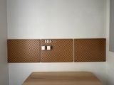a wooden table with a phone on it in a room