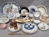many plates and cups and saucers on the table