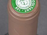a bottle of wine that has a green label on it
