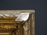 a picture of a gold frame with a picture on it