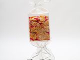 a close up of a bag of cereal on a black stand