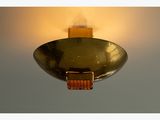 a light that is on above a bowl on the ceiling