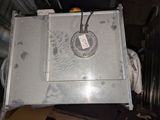 a metal box with a clock on top of it
