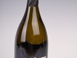 a bottle of wine that is sitting on a table
