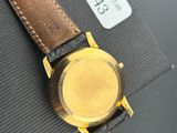 a close up of a watch on a box on a table
