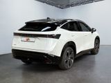 the rear end of a white suv parked in a garage