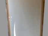 a picture of a mirror with a wooden frame