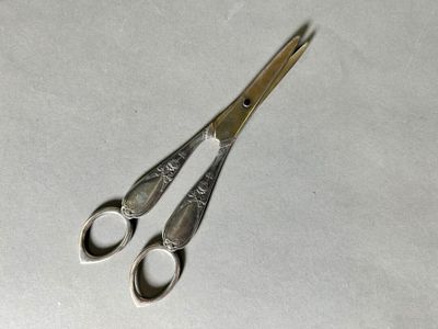 a pair of scissors that are on a table