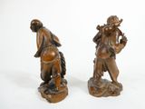 pair of antique bronze figurines of a man and a woman