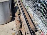 a fence that has a bunch of logs on it