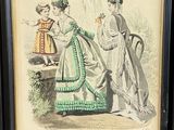framed picture of a woman and a child in a green dress