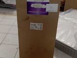 a cardboard box sitting on the floor in a room