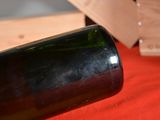 a bottle of wine sitting on a table next to a knife