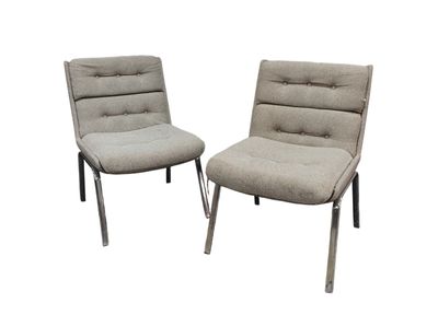 pair of mid - century modern lounge chairs in grey fabric
