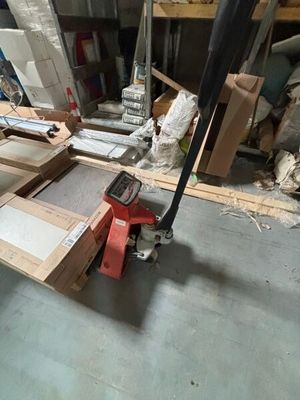 a lot of boxes and tools on the floor in a room