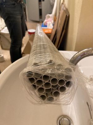 a plastic pipe sticking out of a sink in the bathroom