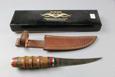 a knife that is sitting next to a box