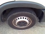 a close up of a tire on the side of a truck