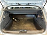 a trunk of a car with a laptop in it