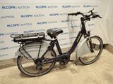 a bike that is parked in front of a wall