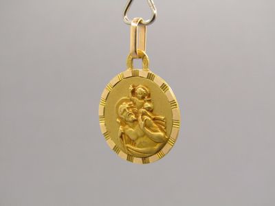 an image of a gold coin with a jesus on it