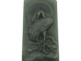 une photo d'une plaque en pierre verte sur laquelle figure un oiseau