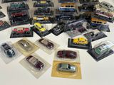 a lot of toy cars that are sitting on a table