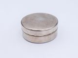 an image of a silver box with a lid on a white surface