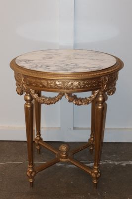 a small table with a marble top in a room