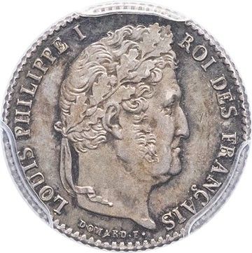 a silver coin with a woman ' s head on it