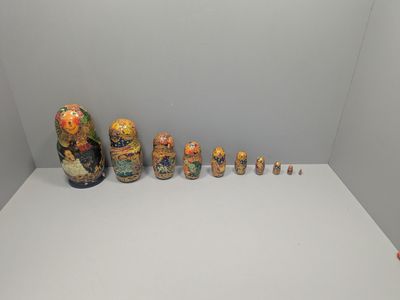 many vases that are lined up on a white table