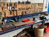 a workbench with many tools on it in a garage