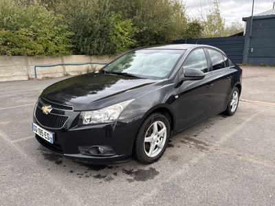 a picture of a black car parked in a parking lot