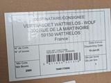 a box with a label on it that says vettaudet wattroos wolf