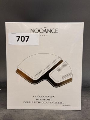 a white box with a brown and black logo on it